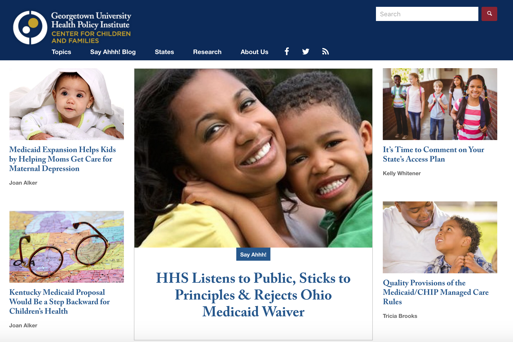 A screenshot of the Georgetown home page, with a blue header and navigation bar at the top, one main featured article and image in the middle of the page surrounded by four smaller articles and images