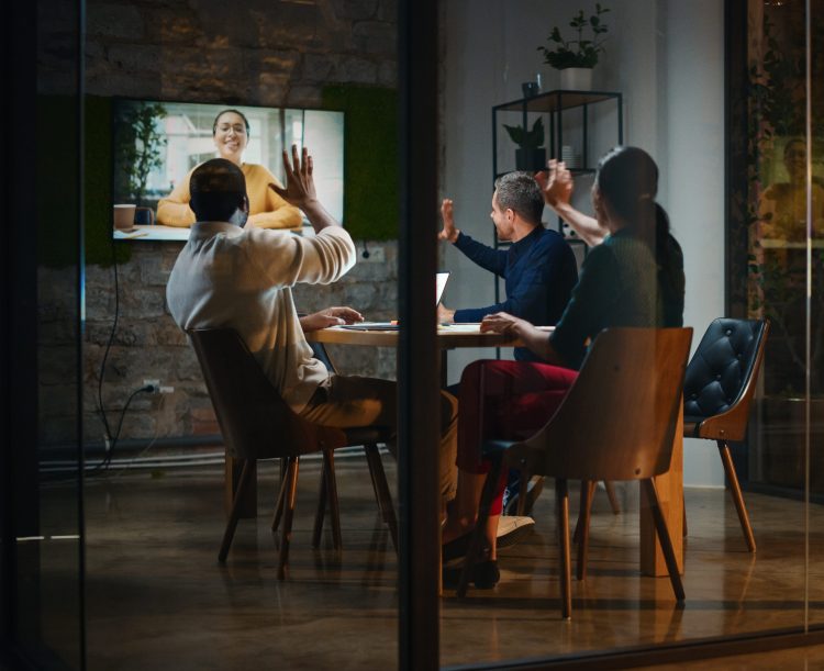 Creative Team on a Conference Video Call in Meeting Room