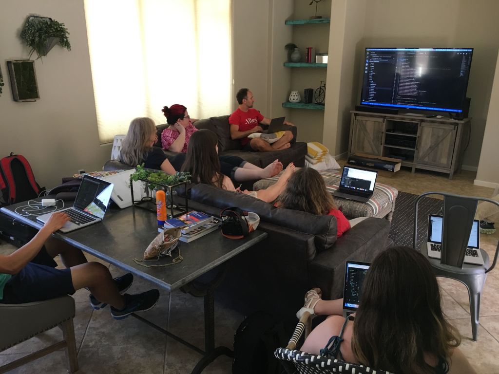 Here’s Team VIP reviewing some code together in a cozy living room.