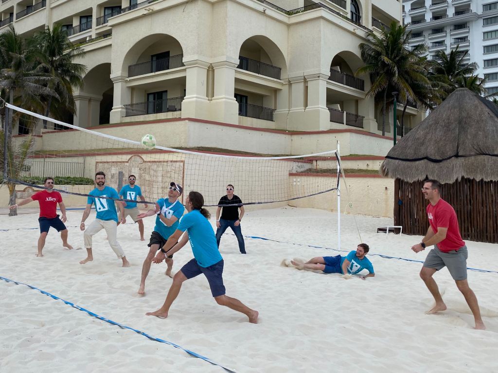 A volleyball game played between two teams of Alley team members.
