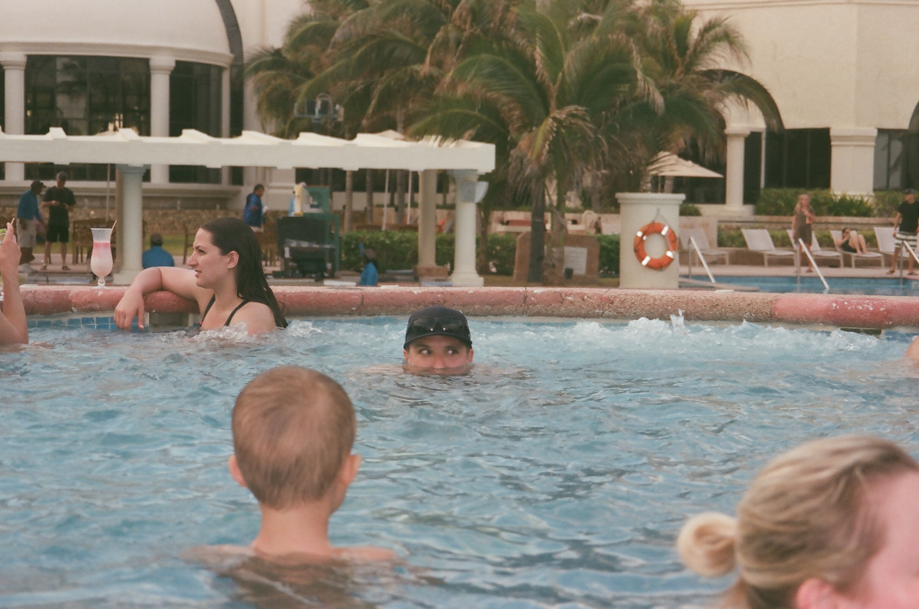 A man in a hot tub, showing only his eyes and the top of his head.