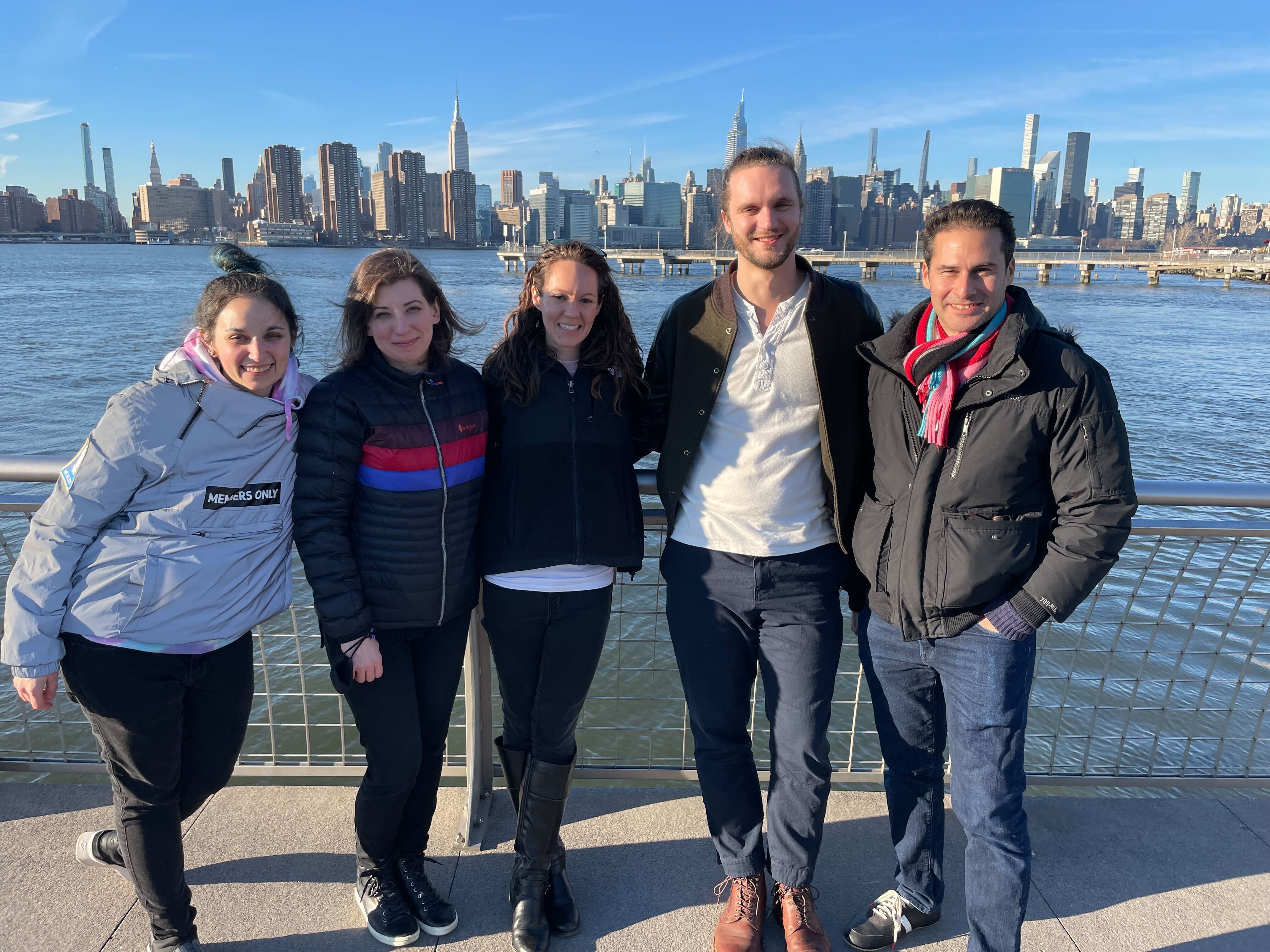 Alley Lede team posing in front of the New York skyline