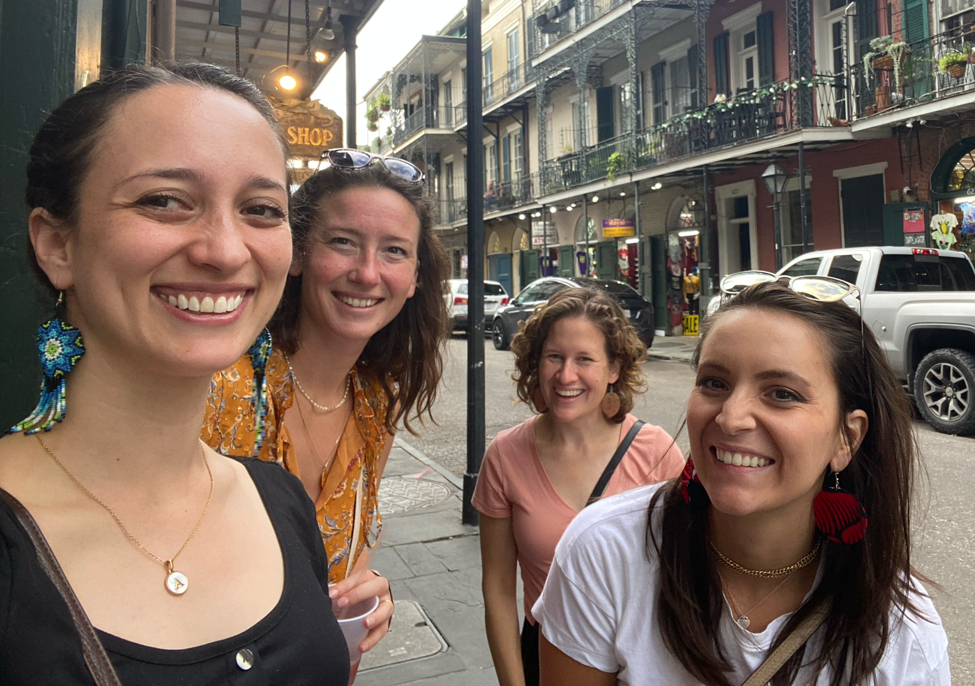 A group of female-identifying Alley employees posing in New Orleans