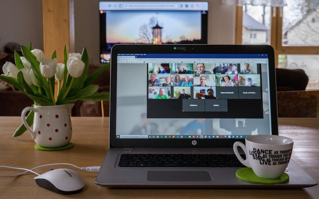 Photo of a laptop with a virtual meeting happening