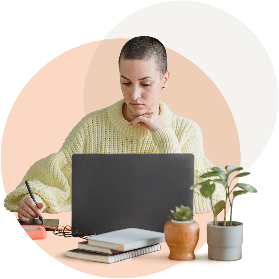 A woman working at her laptop.