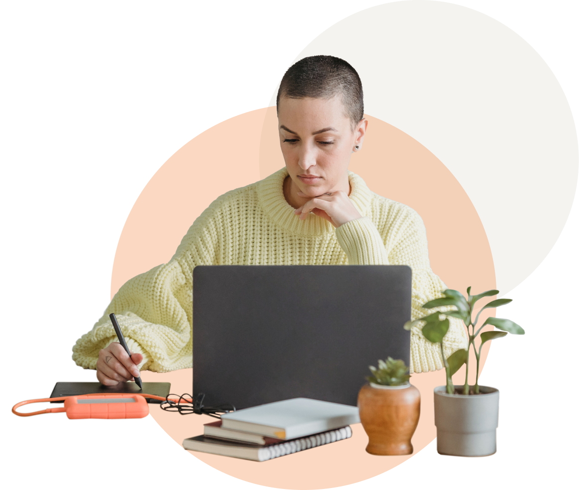 A woman working at her laptop.